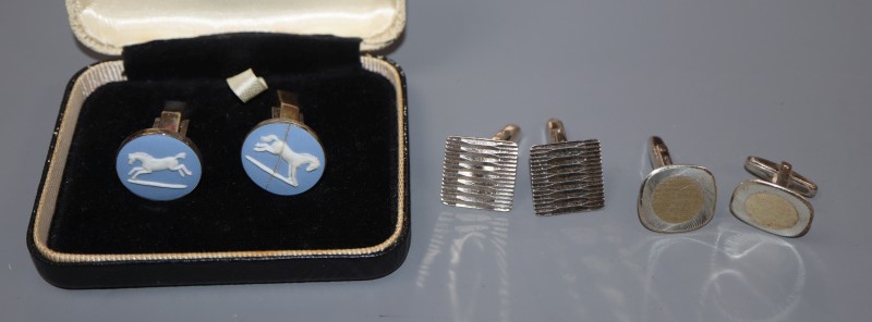 Three pairs of assorted white metal cufflinks.